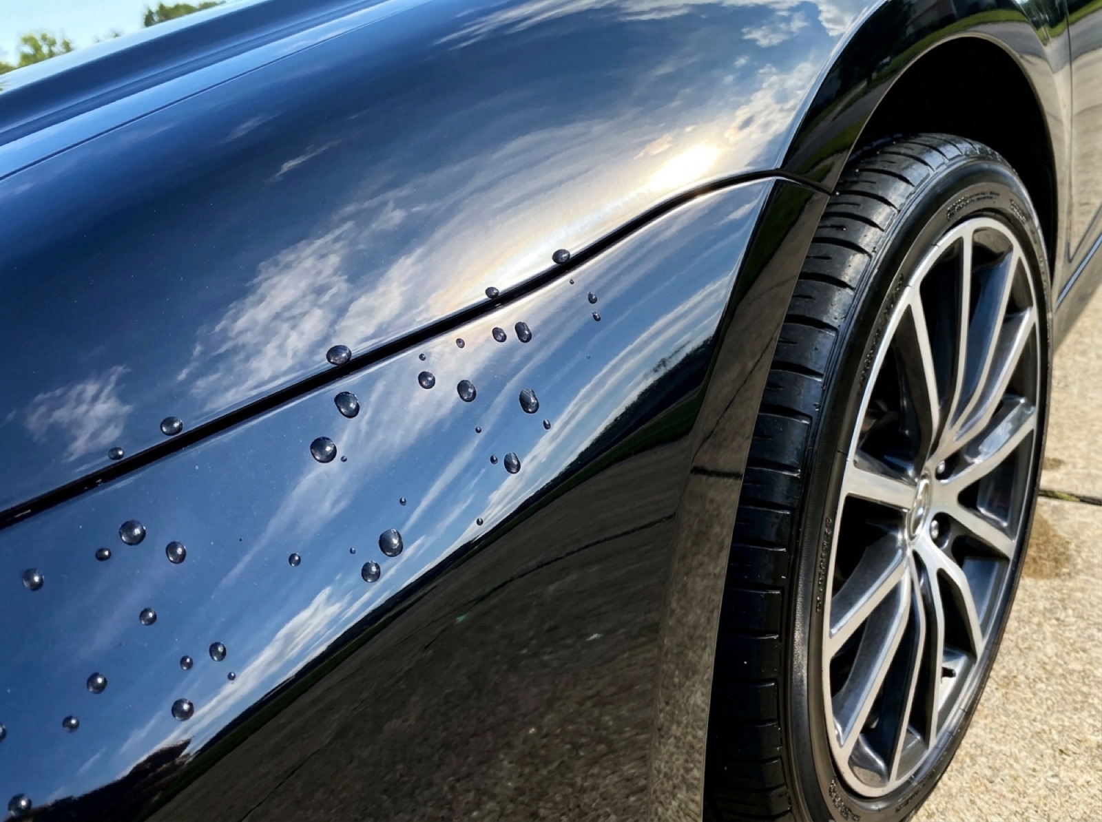 Glossy exterior paint with water beading after an exterior detail